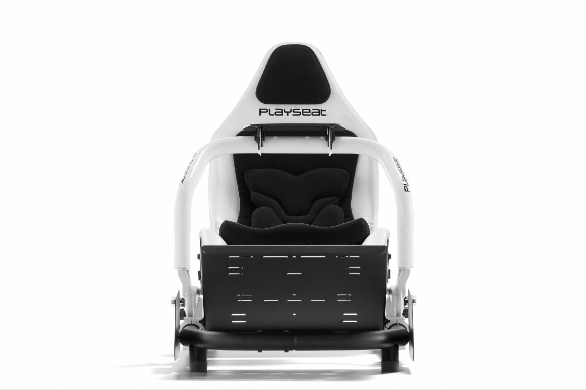 Driver seated in authentic low-slung F1 racing position on Playseat cockpit