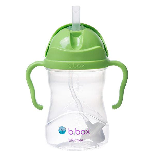 Green sippy cup with straw and handles on a white background