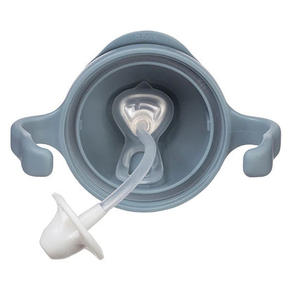 Gray sippy cup with white spout on a white background