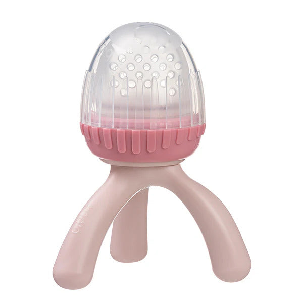 B.Box silicone fresh food feeder for babies with an easy-grip tripod handle and a protective hygiene cap.
