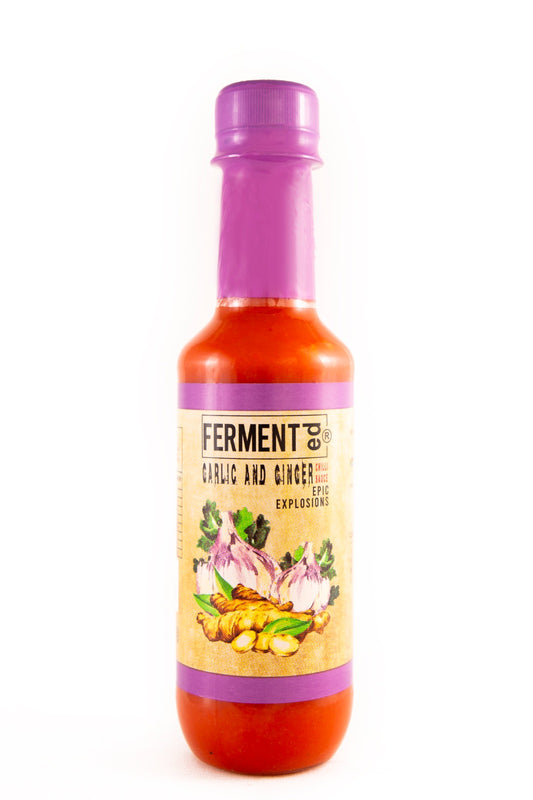 Fermented Garlic And Ginger Chilli Sauce 250ml

FERMENTed Garlic &amp; Ginger Chilli Sauce: A Fusion of Fire and Spice
Starting with premium garlic and ginger, each selected for their potent flavors, this FERMENTed Chilli
Sauce undergoes a transformative fermentation process. The result is a sauce that not only packs a
punch but also carries the rich, tangy undertones of fermentation, creating a unique fusion of fire and spice.