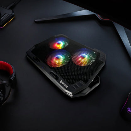 The Redragon GCP511 INGRID 17″ Laptop Cooler is a great way to keep your laptop cool during use. It features a vented base that allows air to pass through and an adjustable stand height to get the perfect viewing and typing angle. It also comes equipped with 3 illuminated RGB fans to help keep your laptop temperatures down. Its sturdy design is big enough to support up to 17″ laptop sizes while its adjustable stoppers on the front can cater for smaller size laptops to prevent them from slipping off the cool