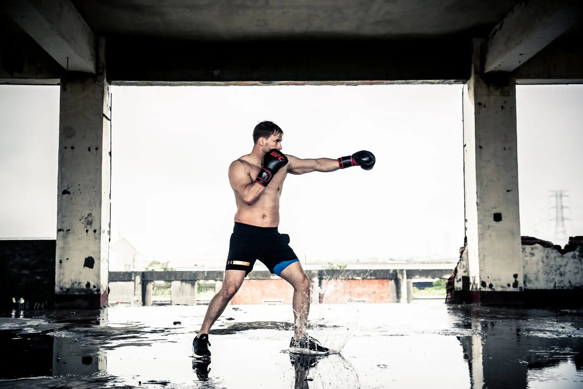 UFC Muay Thai Style Training Gloves
DON’T JUST FUNCTION, PERFORM

Enhance your endurance, strength and sparring skills with this high-energy impact dispersing Thai-style training glove. The internal hand compartment offers a secure, snug fit without sacrificing comfort. Layers of high-density moulded foam keep hands protected during heavy sparring and bag workout sessions. Rigid wrap-around hook &amp; loop closure supports wrist.