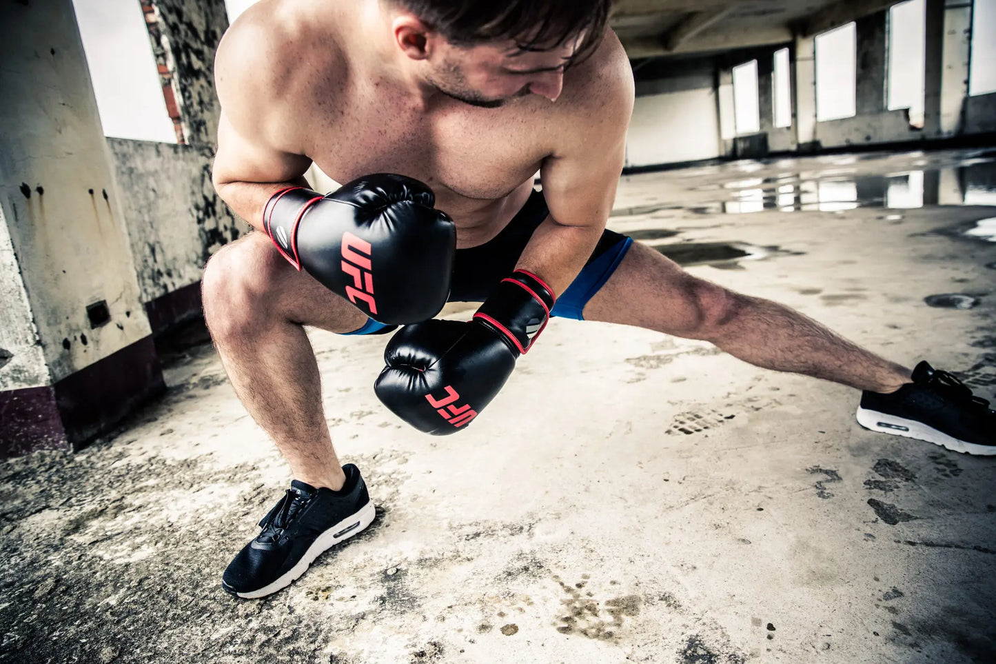 UFC Muay Thai Style Training Gloves
DON’T JUST FUNCTION, PERFORM

Enhance your endurance, strength and sparring skills with this high-energy impact dispersing Thai-style training glove. The internal hand compartment offers a secure, snug fit without sacrificing comfort. Layers of high-density moulded foam keep hands protected during heavy sparring and bag workout sessions. Rigid wrap-around hook &amp; loop closure supports wrist.