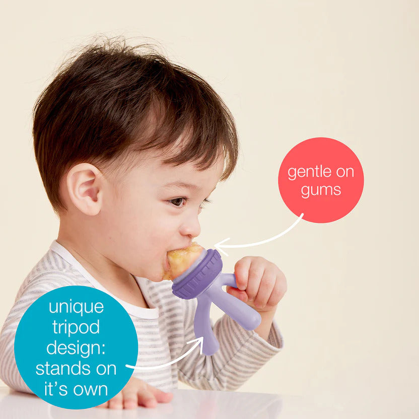 Baby using B.Box silicone feeder for safe fruit introduction