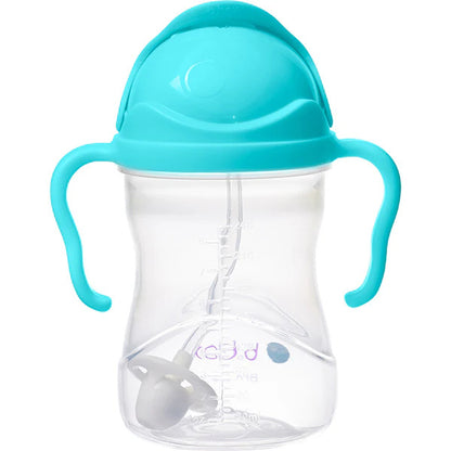 B.Box weighted straw sippy cup held in hand showing compact toddler size