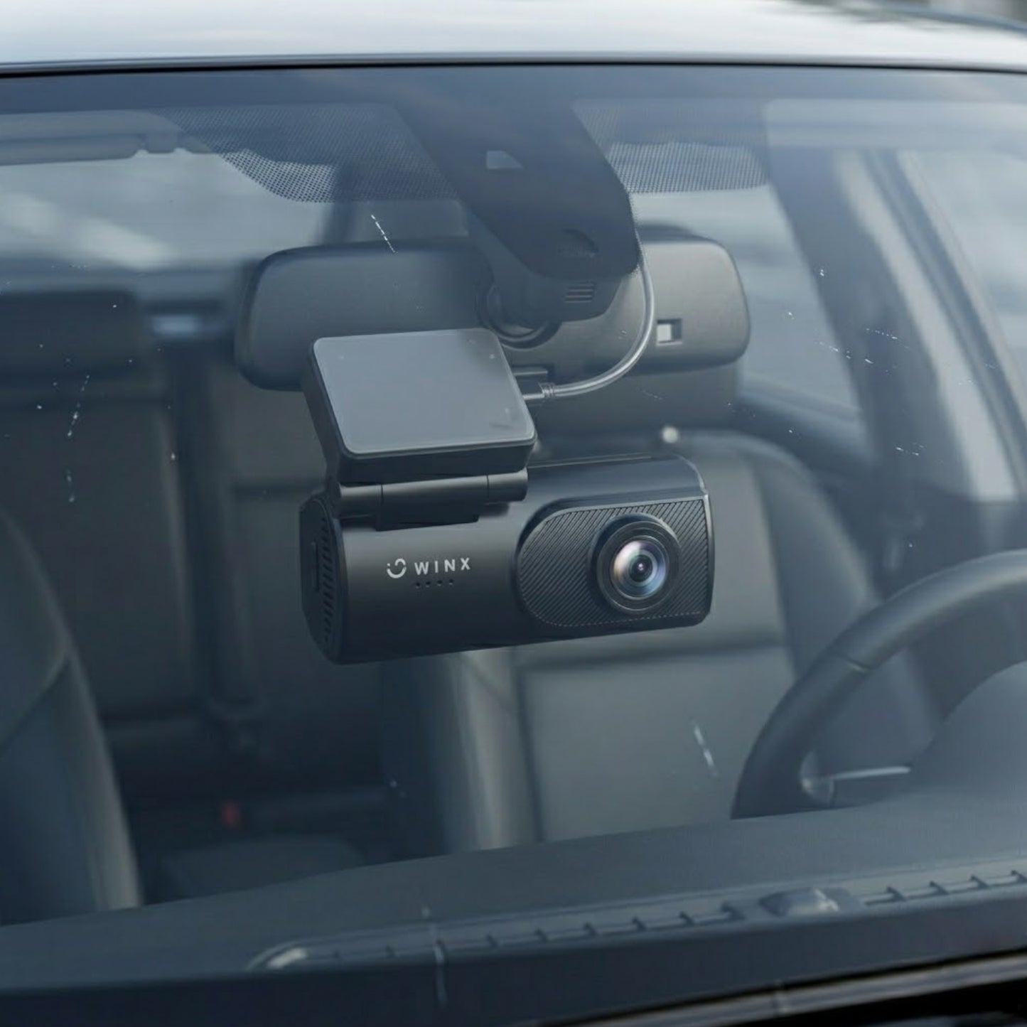 Close-up shot of the F1.8 dash cam lens highlighting its night vision capability