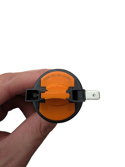 H15 12V 55W halogen globe held in hand showing compact bulb size scale