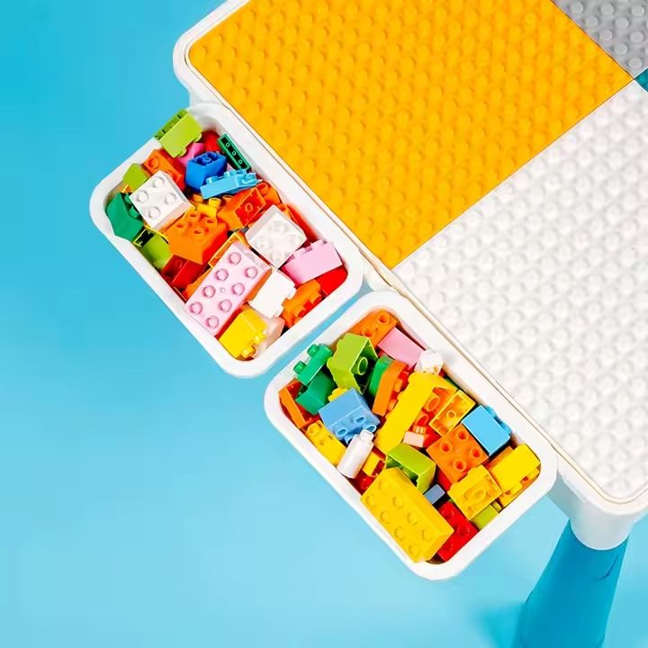 Close-up view of the building block baseplate grid on the Kids-Up activity table