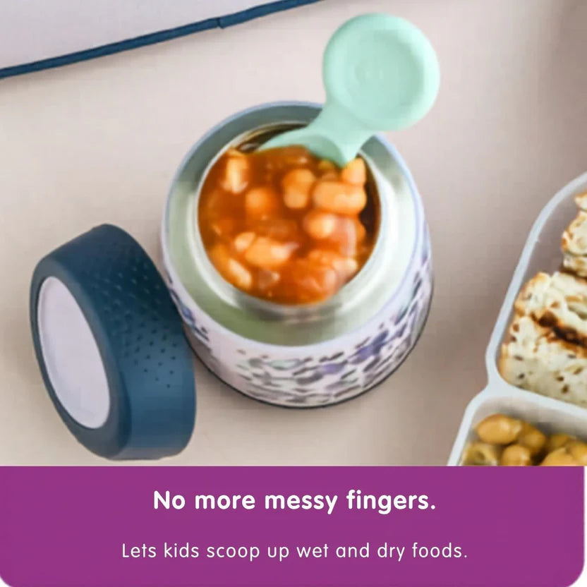 Child using a B.Box Mini Spoon to reach the corner of a lunchbox