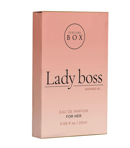 A woman placing the sleek 20ml Lady Boss pocket perfume vial into a luxury leather handbag clutch