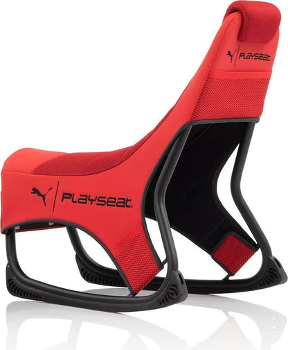 Unboxing layout showing Playseat Puma chair warranty card and manual