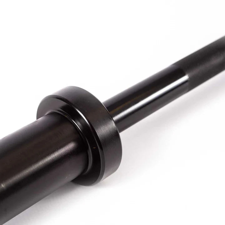 Close up of the 50mm Olympic sleeve on the 152cm black Powercore barbell showing the brass bushing build