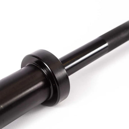 Close up of the 50mm Olympic sleeve on the 152cm black Powercore barbell showing the brass bushing build