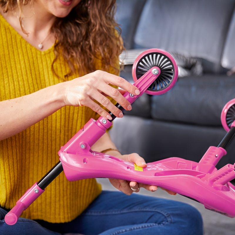Close-up of stable, non-scratch caster wheels on the Scuttlebug trike