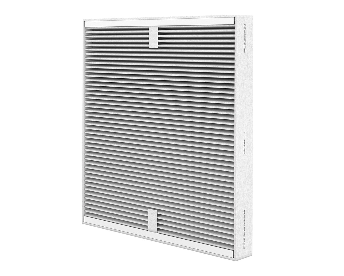 Stadler Form Roger Little white air purifier placed in modern bedroom setup