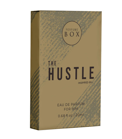 Three Perfume Box The Hustle travel sprays arranged next to business cards, car keys, and a gym bag