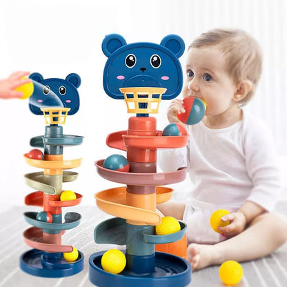 Toddler dropping balls into the Kids-Up rotating ball tower for motor skills