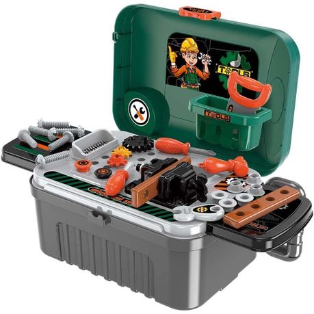A toddler pulling the portable construction tool luggage trolley across a playroom floor