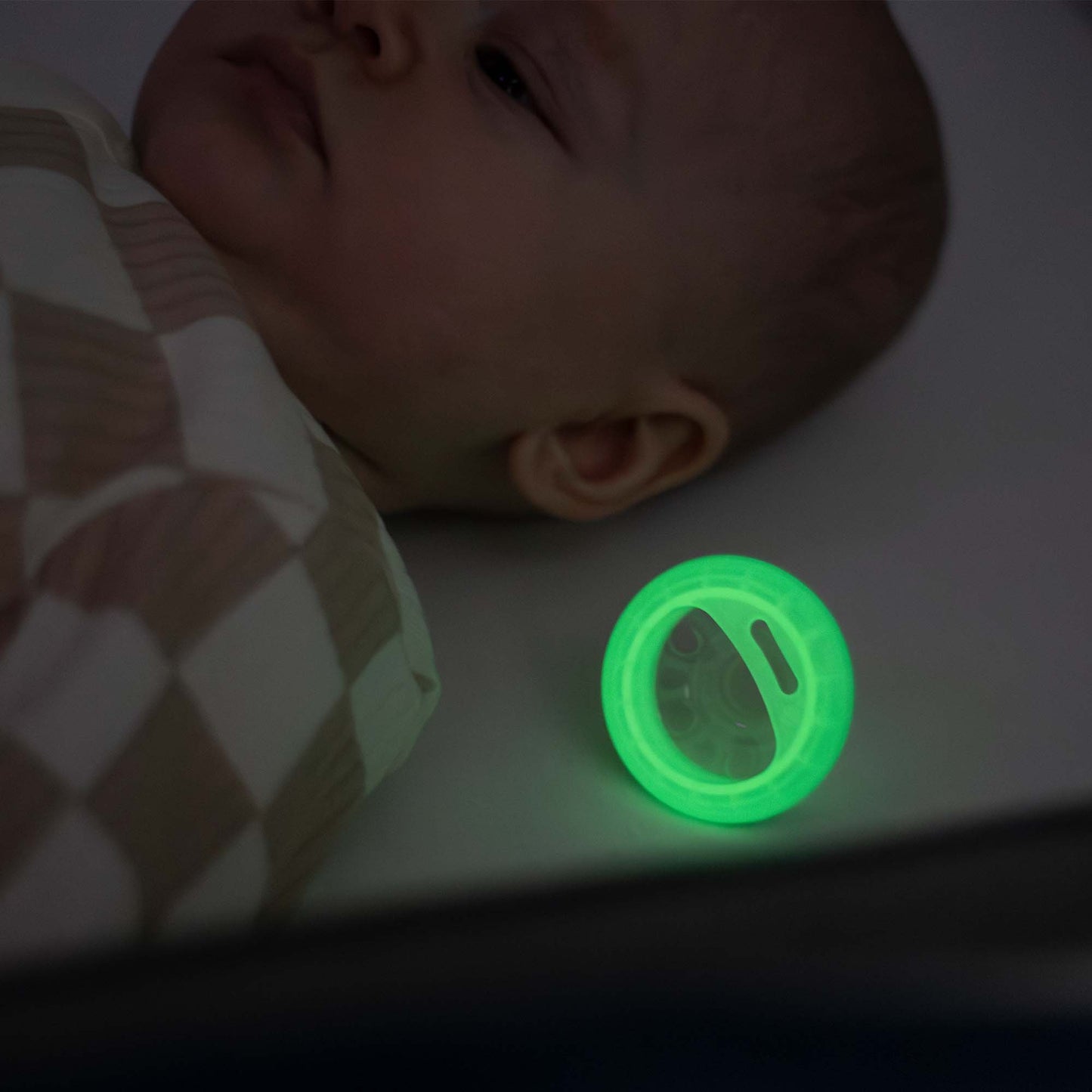 Side profile showing skin-contouring arched shield on Tommee Tippee night soother