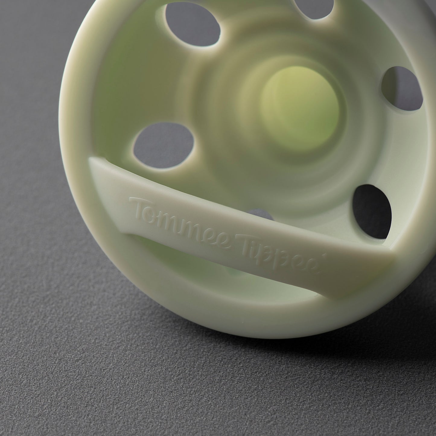 Side profile view showing curved facial shield on Tommee Tippee 0-6M breastlike soother