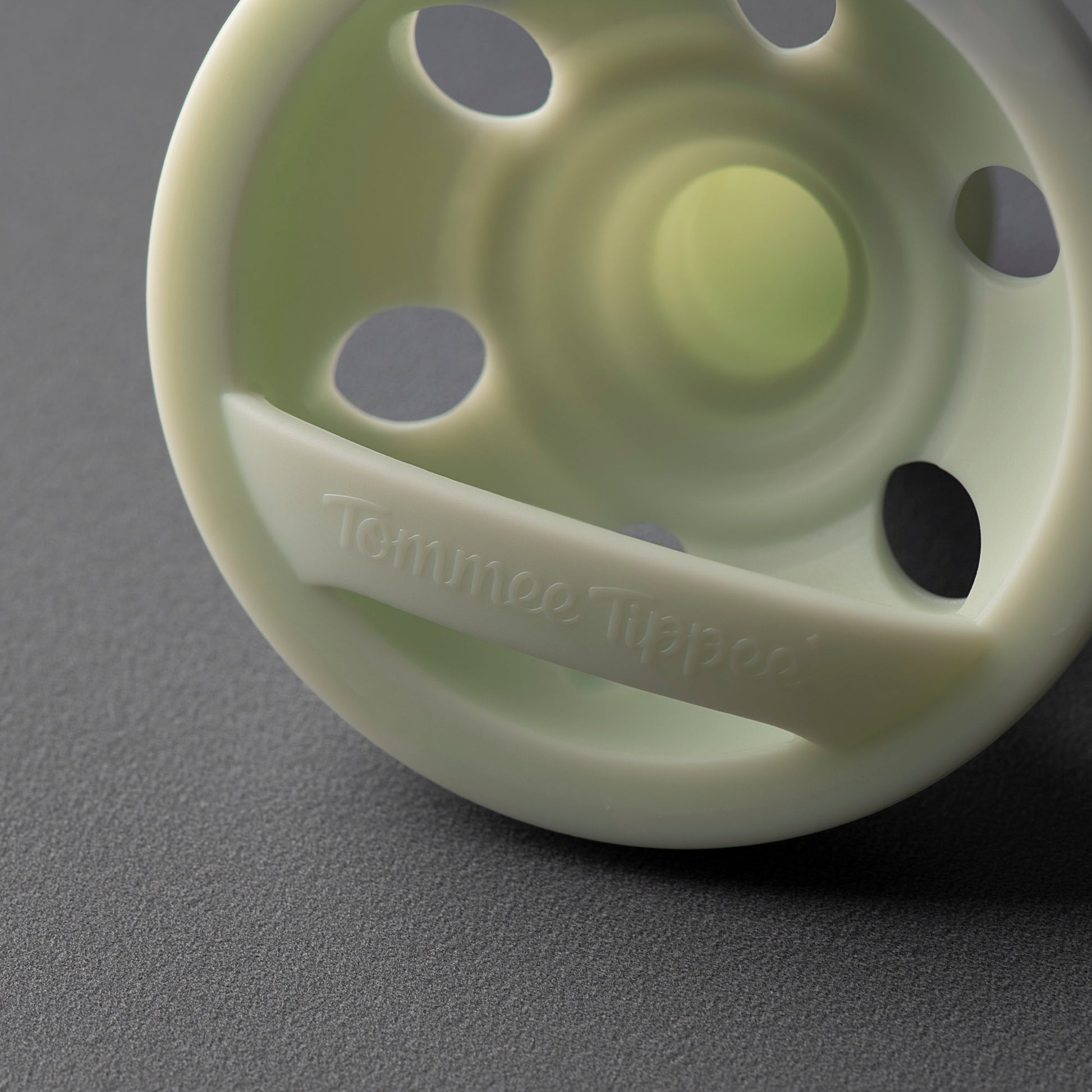 Side profile view showing curved facial shield on Tommee Tippee 0-6M breastlike soother