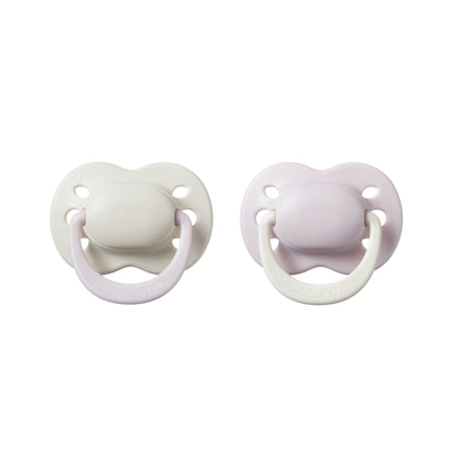 Pair of Tommee Tippee newborn girl pacifiers 0 to 2 months in soft pink shades