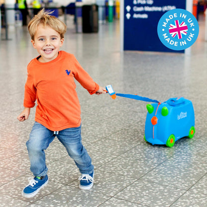 Side profile view of Terrance blue Trunki ride-on suitcase with inline skate wheels