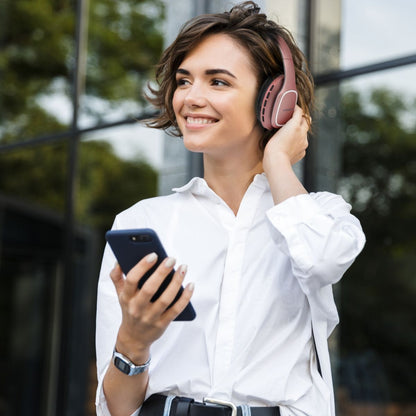 User wearing Volkano Phonic Series headphones during work study session